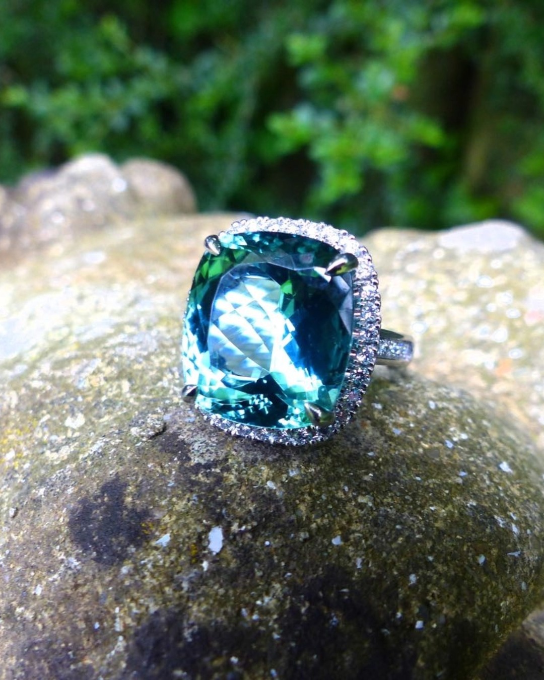 Close-up of the 13.13 ct blue-green tourmaline and surrounding diamond halo